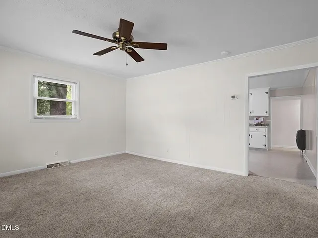 an empty room with closet area