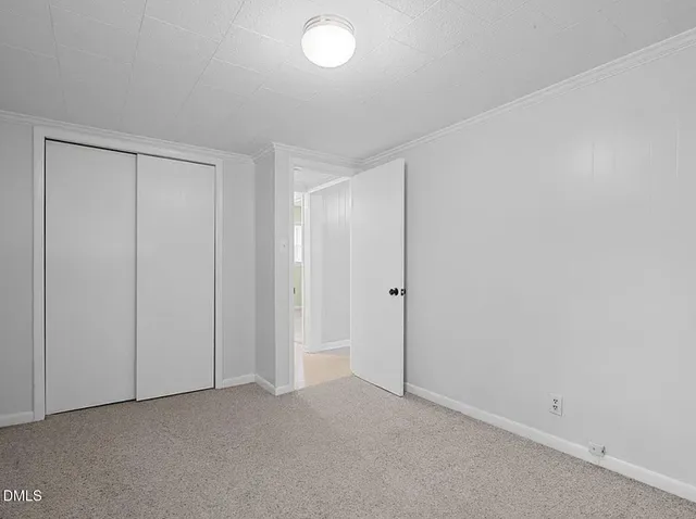 a room with furniture and painting on the wall