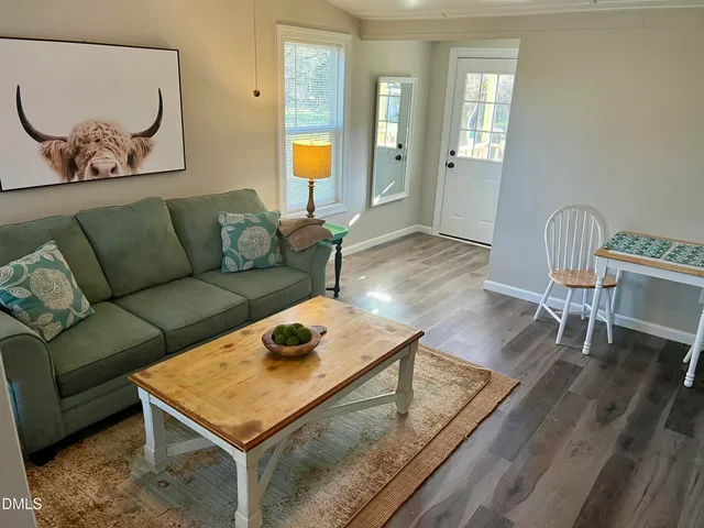 a bathroom with a sink mirror and toilet