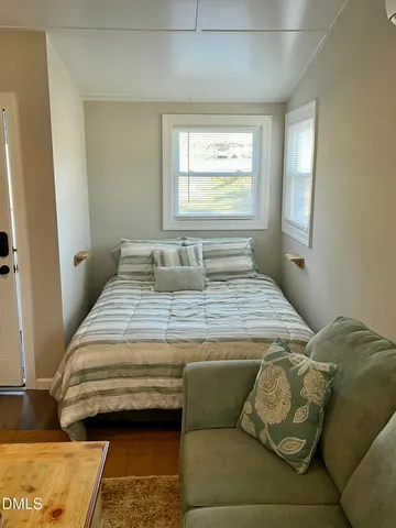 a view of a yard with basketball court