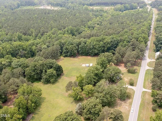 a view of a lake with large trees