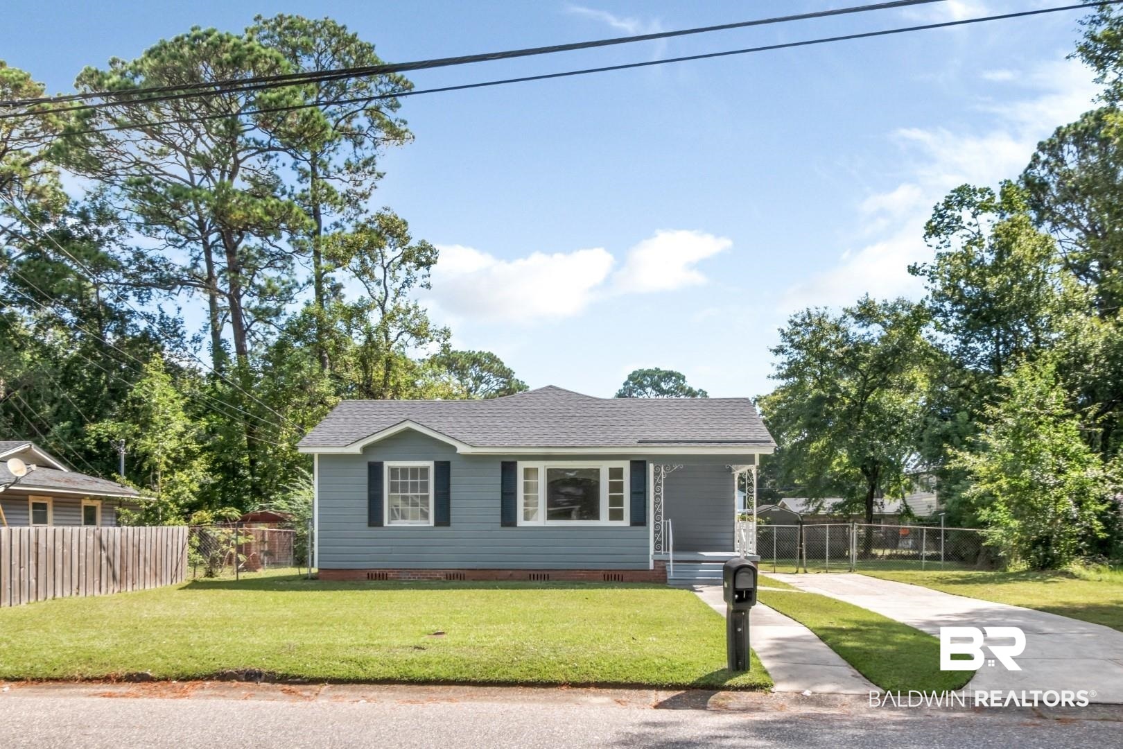 1477 Fairfield Street Mobile, AL 36606 - Photo 2 of 34 View of front of home featuring crawl space, roof with shingles, and driveway