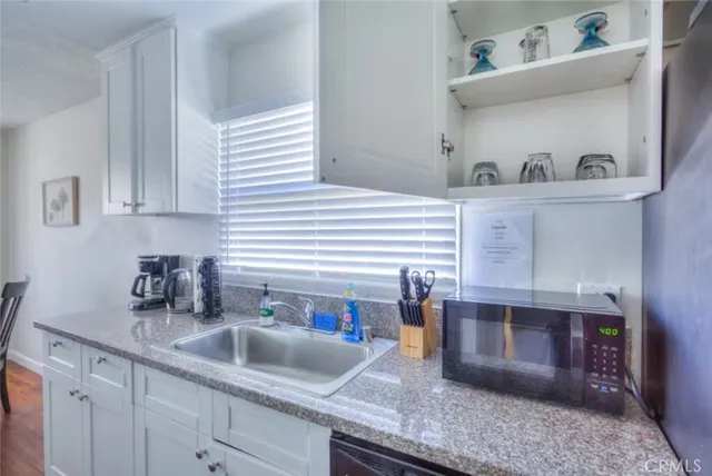 a kitchen with a sink and cabinets
