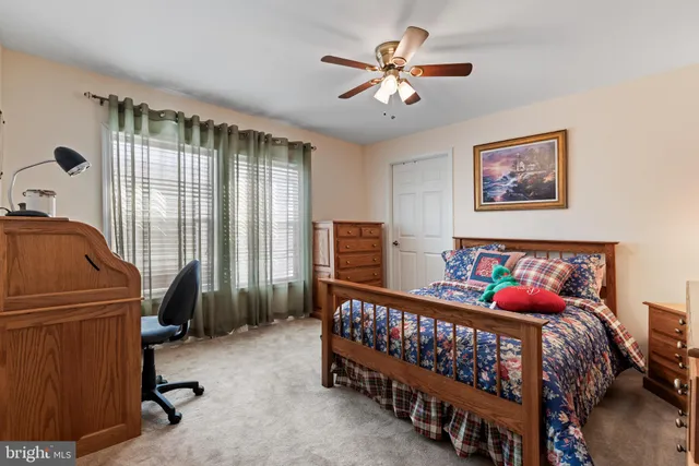 a bedroom with furniture and windows