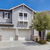 a front view of a house with garage