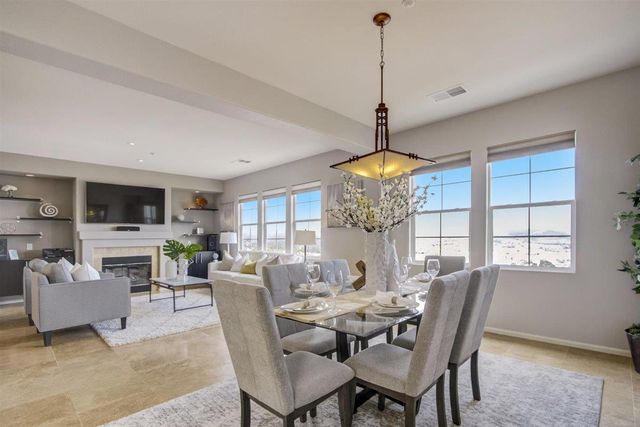 a view of a dining room with furniture wooden floor and chandelier