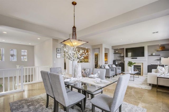 a kitchen with stainless steel appliances granite countertop a refrigerator stove and sink