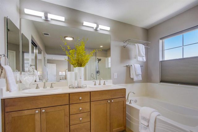 a bedroom with a bed and a tv