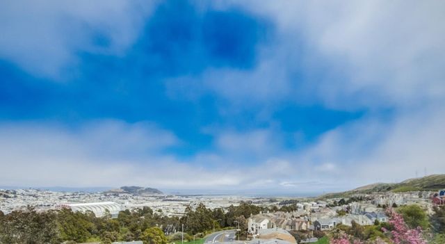 a view of a patio with a chairs and table in a patio