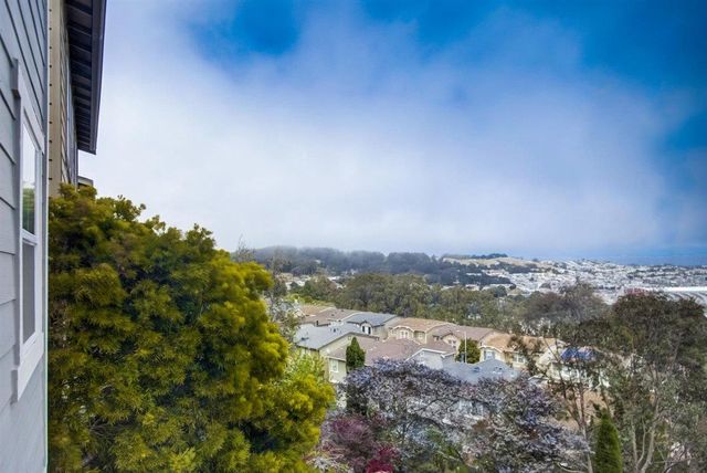 a front view of a house with garage