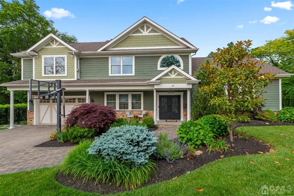 47 Agate Road East Brunswick, NJ 08816 - Photo 1 of 47 a front view of a house with a garden