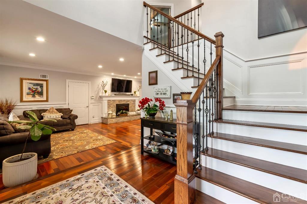 47 Agate Road East Brunswick, NJ 08816 - Photo 11 of 47 a living room with fireplace furniture or stairs and a wooden floor