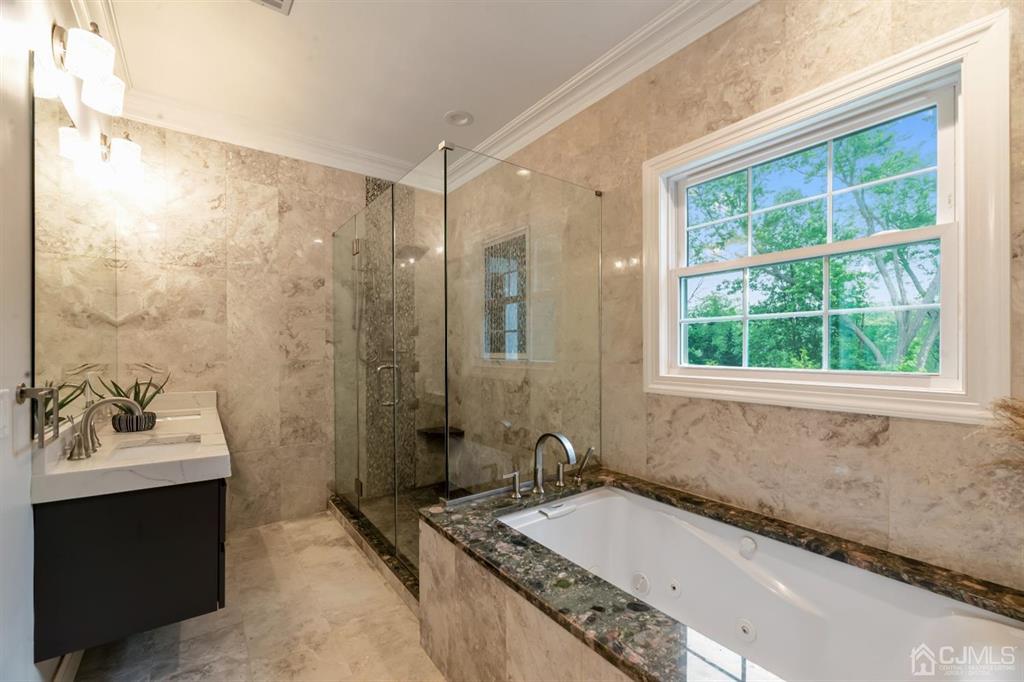 47 Agate Road East Brunswick, NJ 08816 - Photo 18 of 47 a bathroom with a granite countertop tub sink and mirror