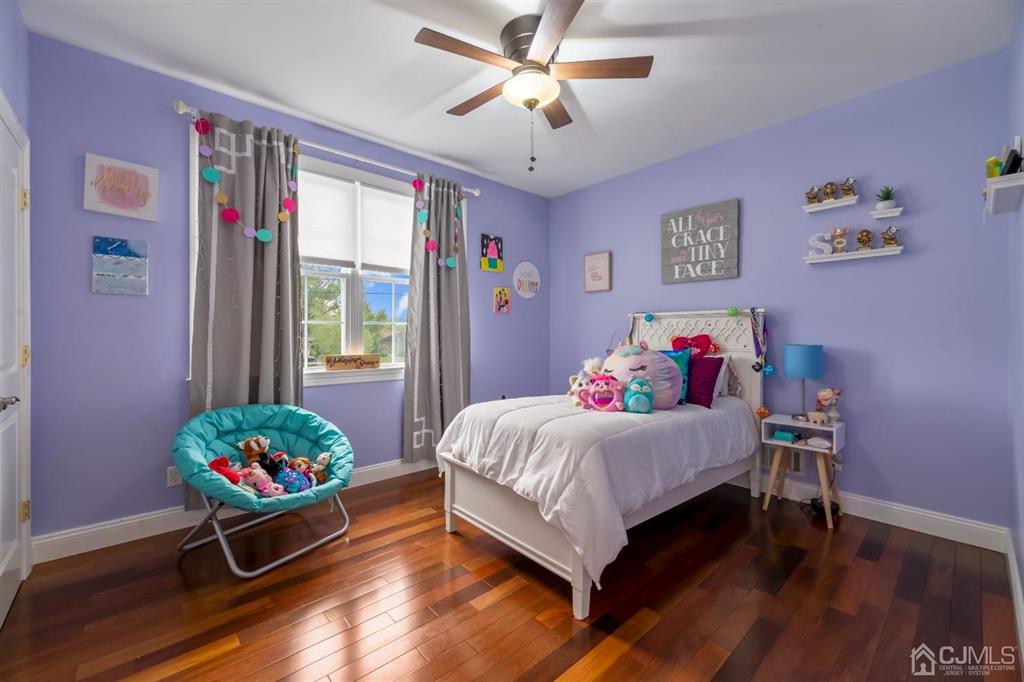 47 Agate Road East Brunswick, NJ 08816 - Photo 21 of 47 a bedroom with a bed and a chandelier