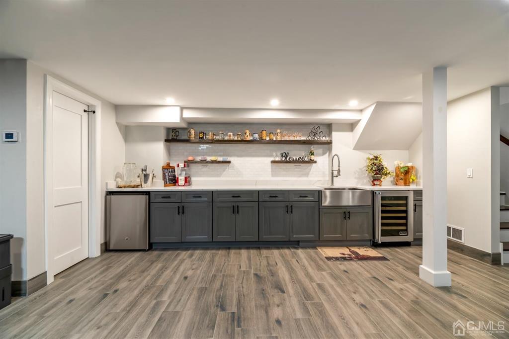47 Agate Road East Brunswick, NJ 08816 - Photo 28 of 47 a kitchen with stainless steel appliances cabinets and wooden floor