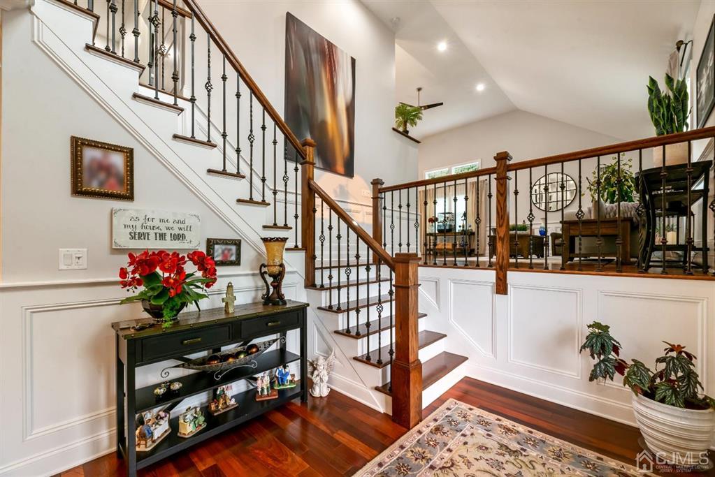 47 Agate Road East Brunswick, NJ 08816 - Photo 3 of 47 a view of staircase with lots of frames on wall and a window
