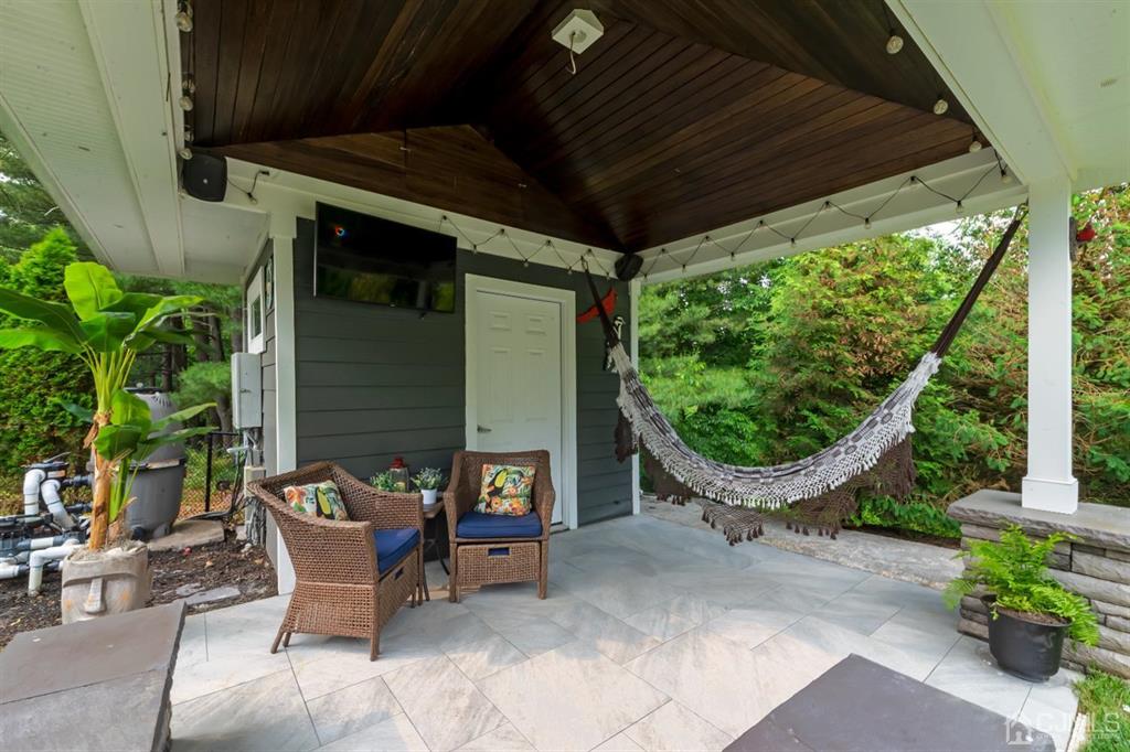 47 Agate Road East Brunswick, NJ 08816 - Photo 34 of 47 a patio with table and chairs