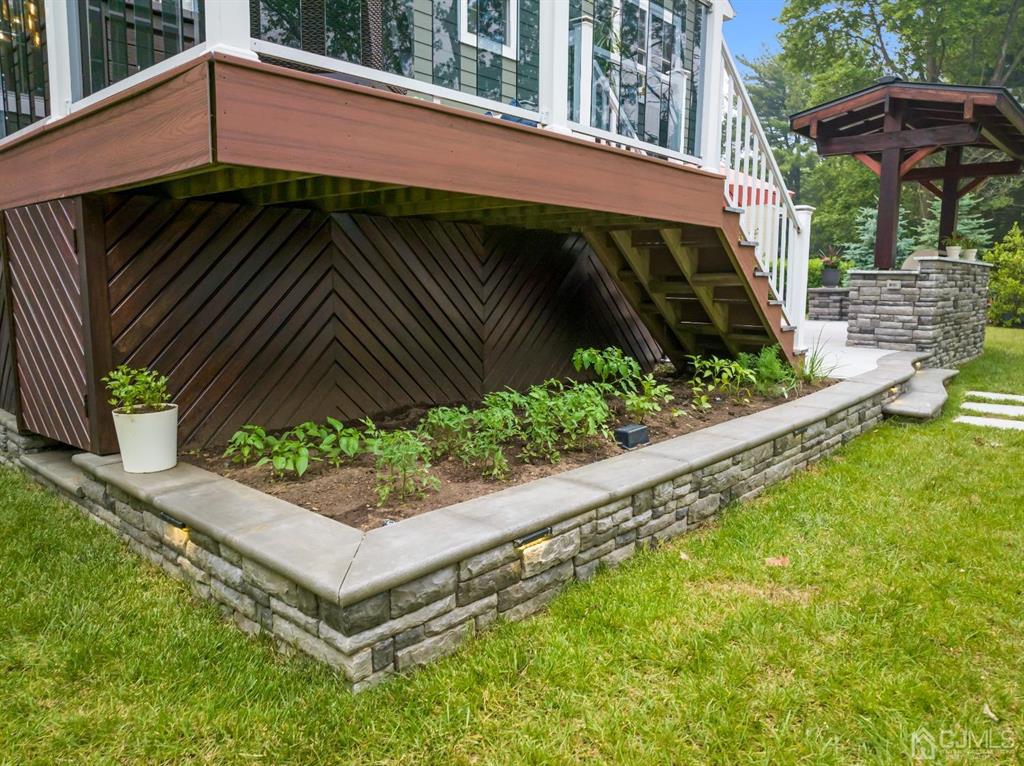 47 Agate Road East Brunswick, NJ 08816 - Photo 38 of 47 a view of a small garden area with an umbrella