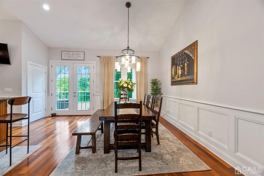 47 Agate Road East Brunswick, NJ 08816 - Photo 8 of 47 a dining room with furniture a chandelier and wooden floor