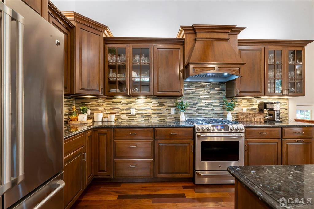 47 Agate Road East Brunswick, NJ 08816 - Photo 9 of 47 a kitchen with stainless steel appliances granite countertop a stove and a refrigerator