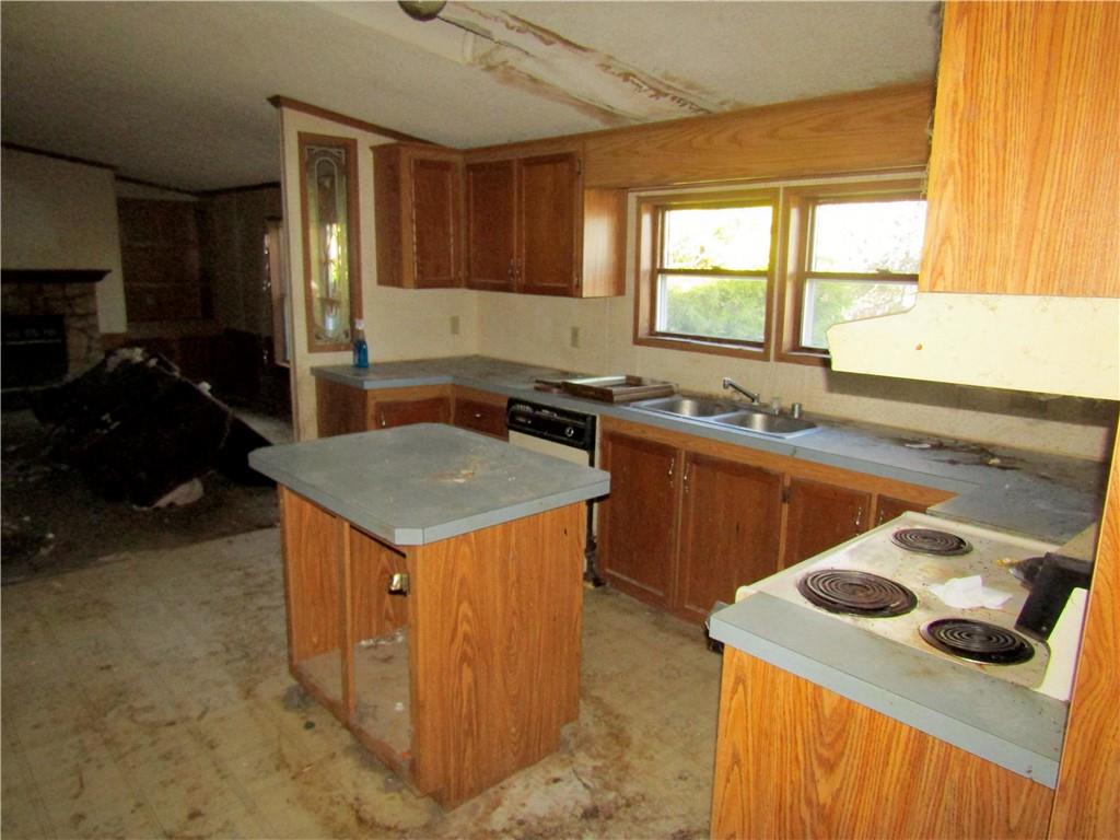 123 Stern Street Friedens, PA 15541 - Photo 9 of 16 a kitchen that has a sink and a stove in it