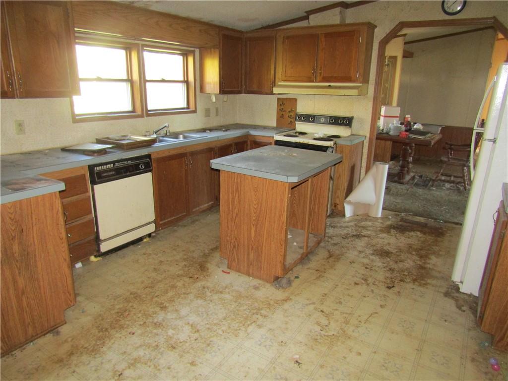 123 Stern Street Friedens, PA 15541 - Photo 10 of 16 a kitchen with stainless steel appliances granite countertop a sink stove and cabinets