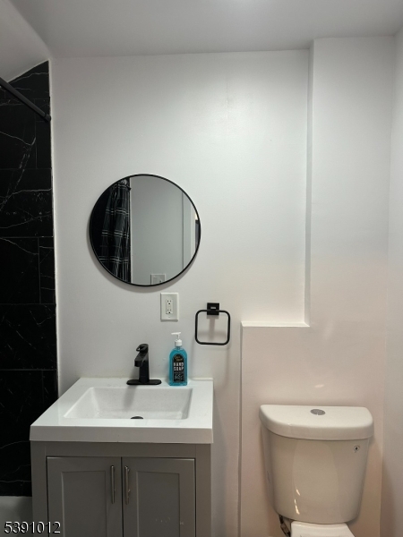 26 Duryea Street Newark, NJ 07103 - Photo 14 of 15 a bathroom with a toilet a sink and a mirror