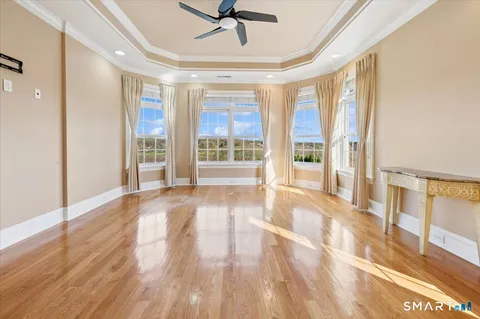 a view of an entryway with wooden floor