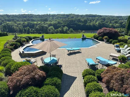 a view of a swimming pool and lounge chair