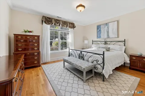 a bed room with a bed and a window