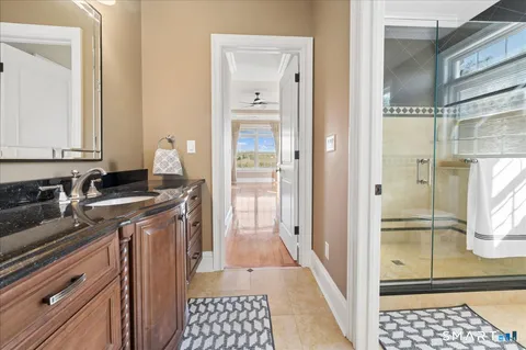 a kitchen with a refrigerator and a sink