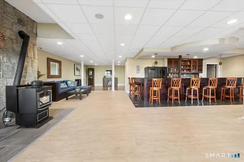 a living room with lots of furniture and kitchen view
