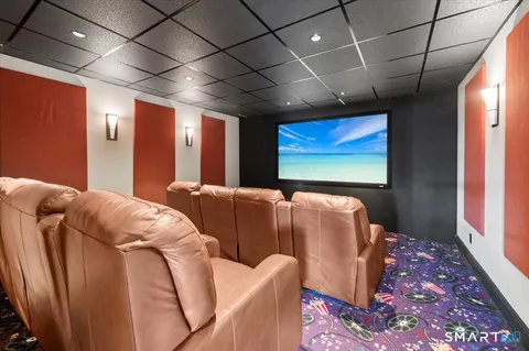 a bed room with furniture and a flat screen tv