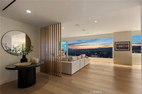 a view of a living room and dining room
