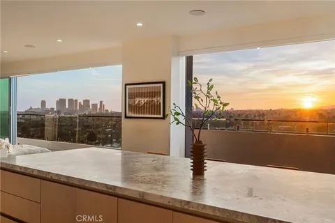 a view of a living room and floor to ceiling window