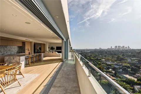 a view of a living room and kitchen
