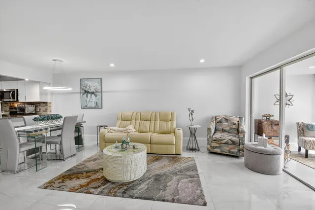 a bedroom with a large window and a bed