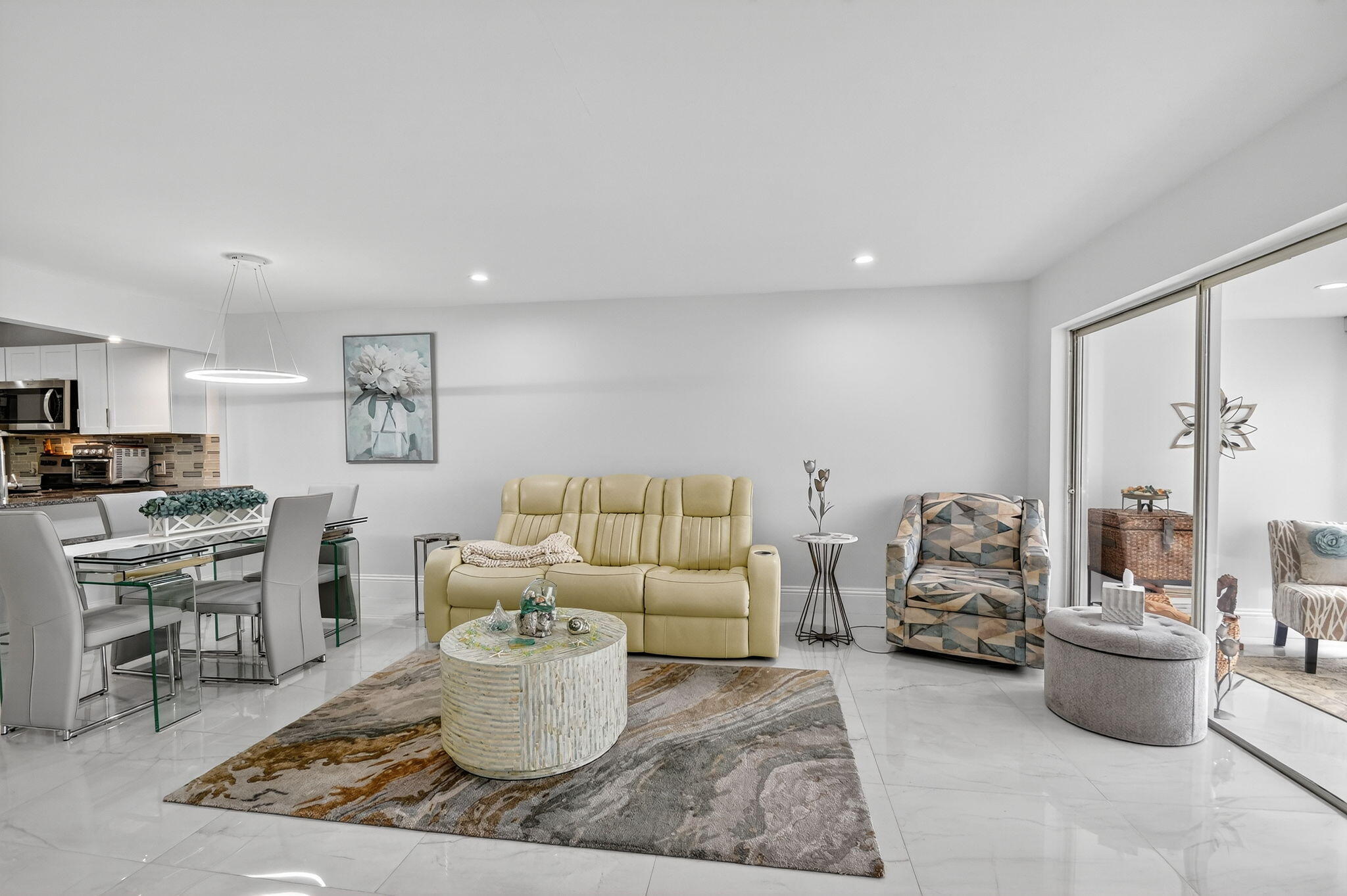 4381 Trevi Court, Unit 303 Lake Worth, FL 33467 - Photo 15 of 80 a living room with furniture and a potted plant