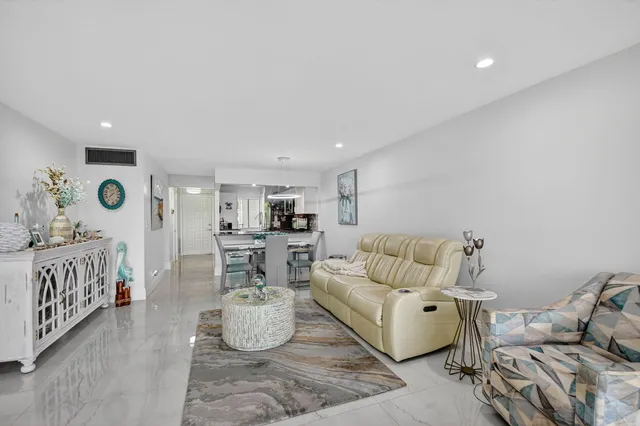 a bedroom with furniture and a large window