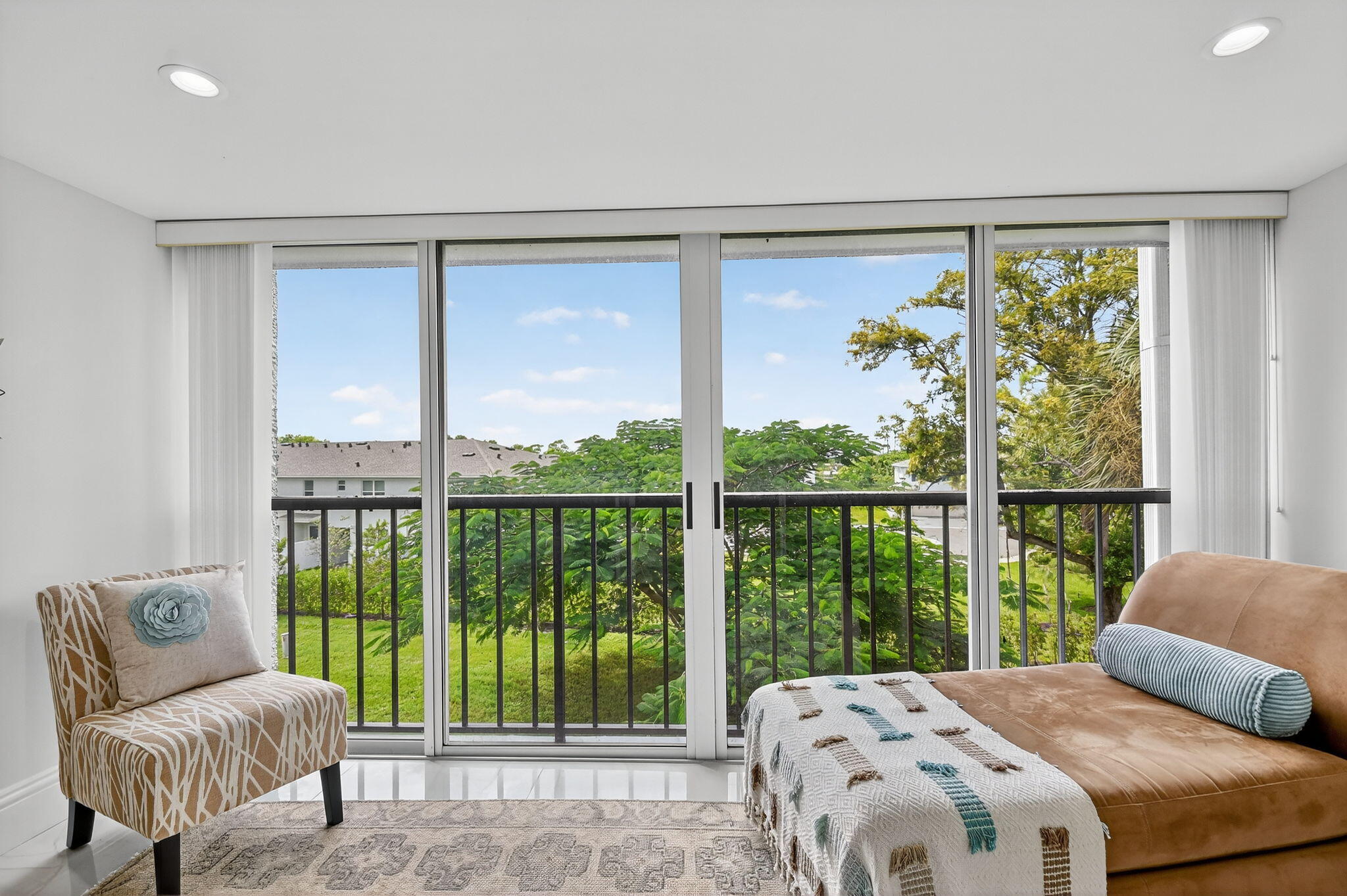 4381 Trevi Court, Unit 303 Lake Worth, FL 33467 - Photo 17 of 80 a bedroom with a large window and a bed