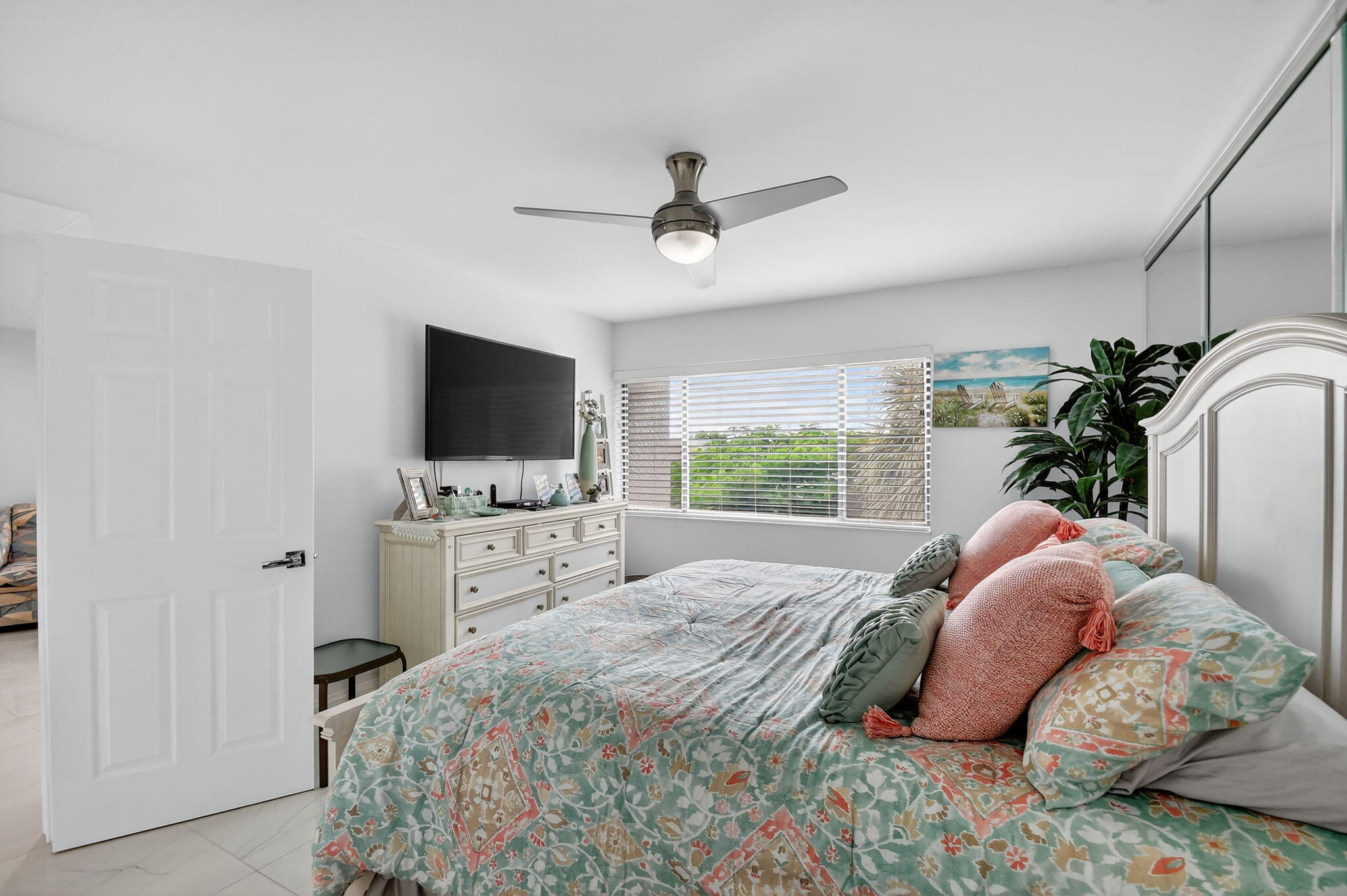 4381 Trevi Court, Unit 303 Lake Worth, FL 33467 - Photo 23 of 80 a bedroom with a bed and a flat screen tv