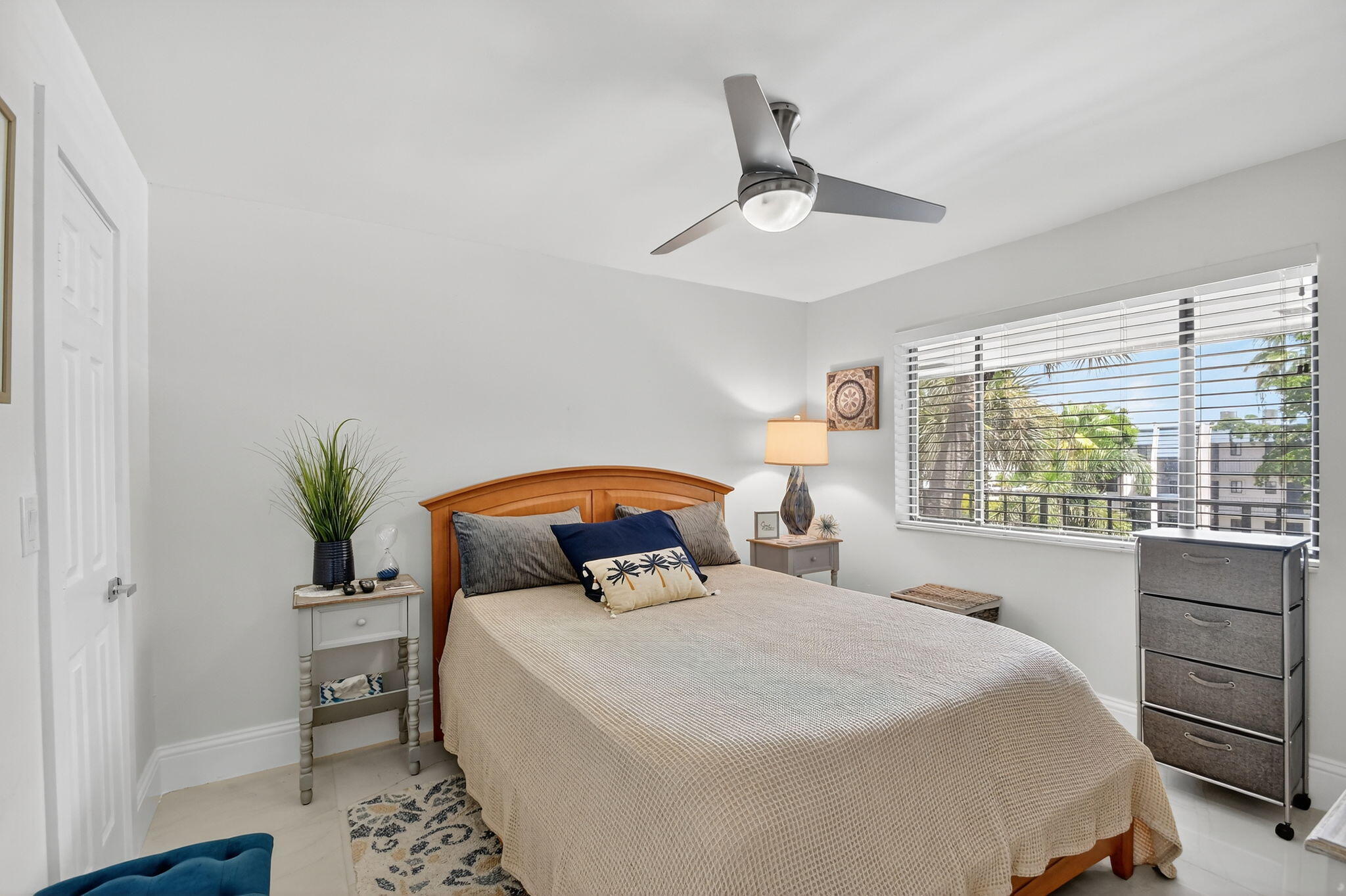 4381 Trevi Court, Unit 303 Lake Worth, FL 33467 - Photo 26 of 80 a bedroom with a large bed and a window