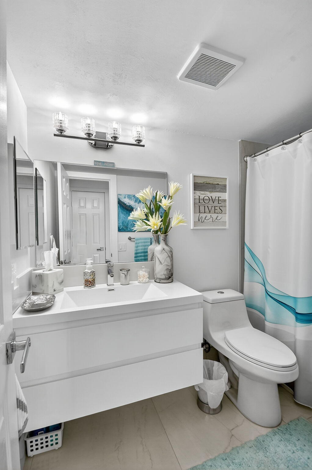 4381 Trevi Court, Unit 303 Lake Worth, FL 33467 - Photo 29 of 80 a bathroom with a sink mirror vanity and toilet