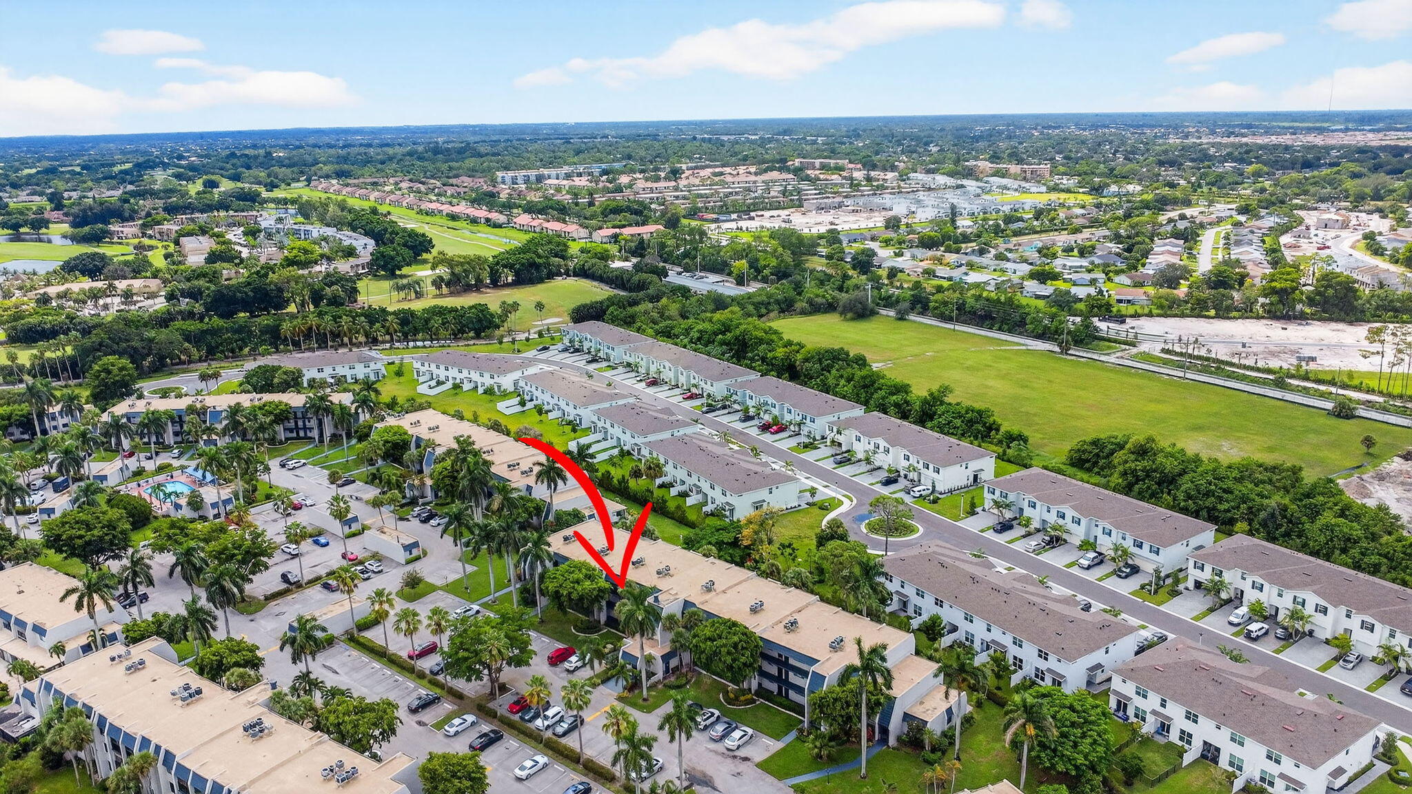 4381 Trevi Court, Unit 303 Lake Worth, FL 33467 - Photo 36 of 80 an aerial view of a city with lots of residential buildings