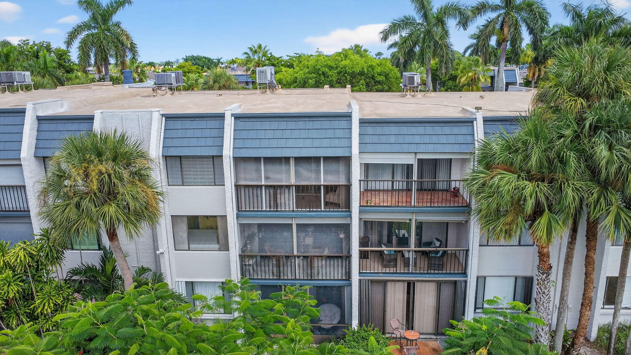 4381 Trevi Court, Unit 303 Lake Worth, FL 33467 - Photo 43 of 80 a house view with a garden space