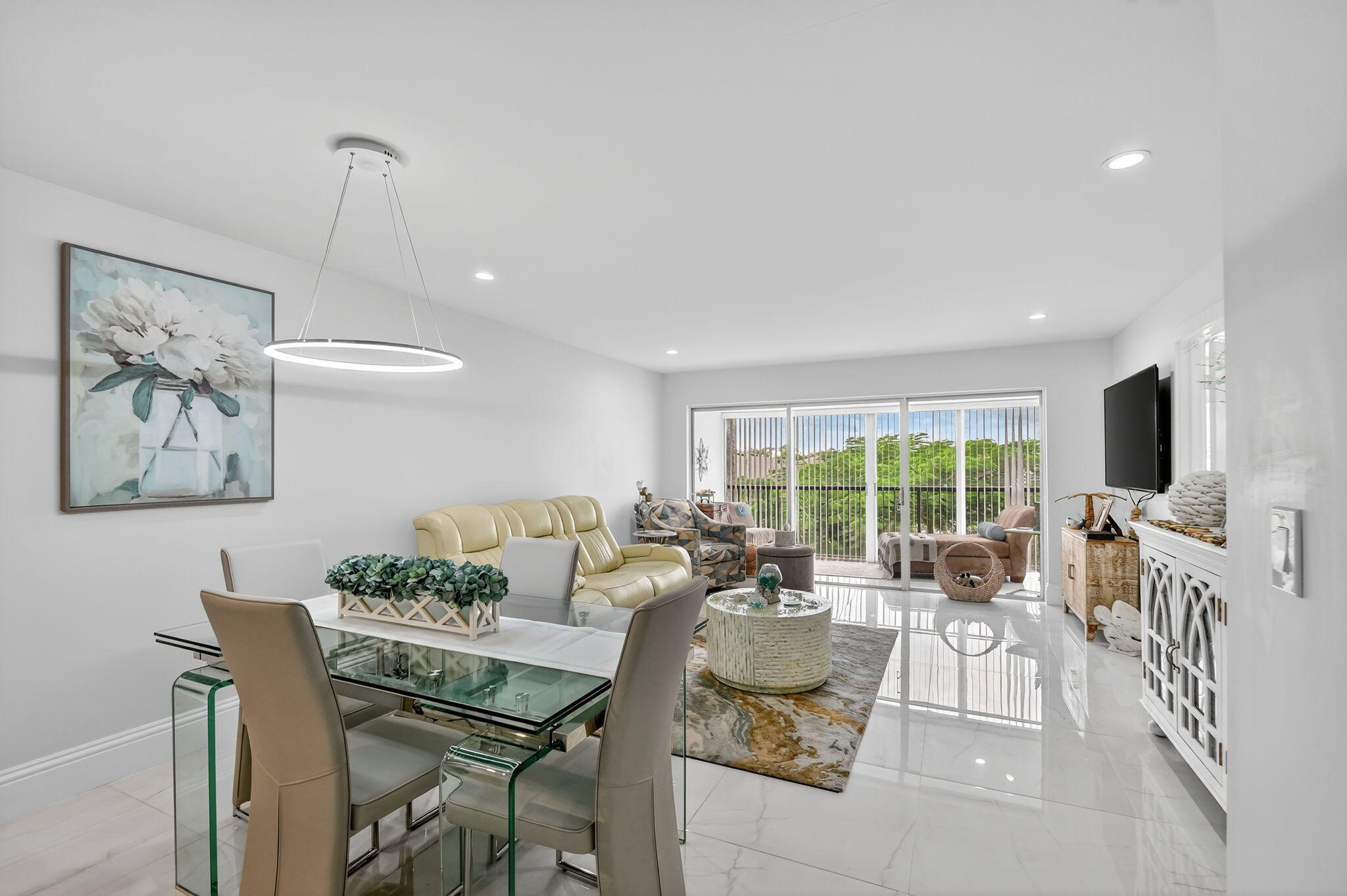 4381 Trevi Court, Unit 303 Lake Worth, FL 33467 - Photo 9 of 80 a living room with furniture and a large window