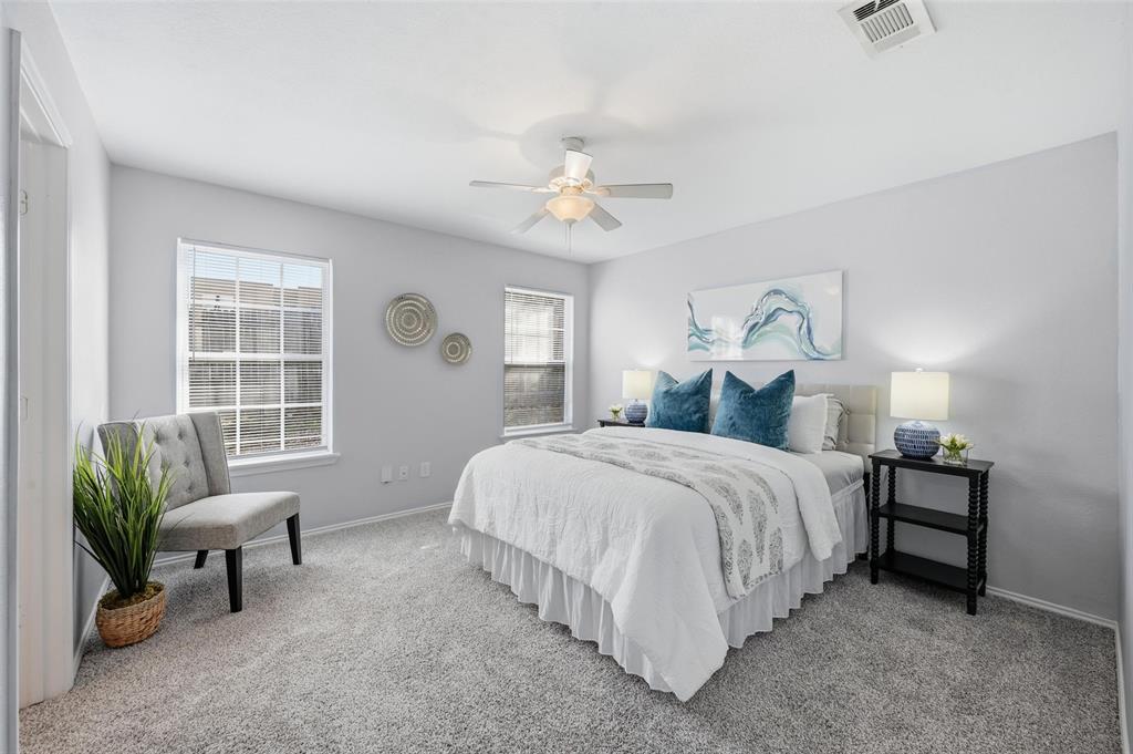 116 Main Place Euless, TX 76040 - Photo 13 of 31 a spacious bedroom with a bed and a couch