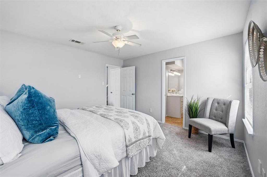 116 Main Place Euless, TX 76040 - Photo 14 of 31 a bed room with a bed and a couch