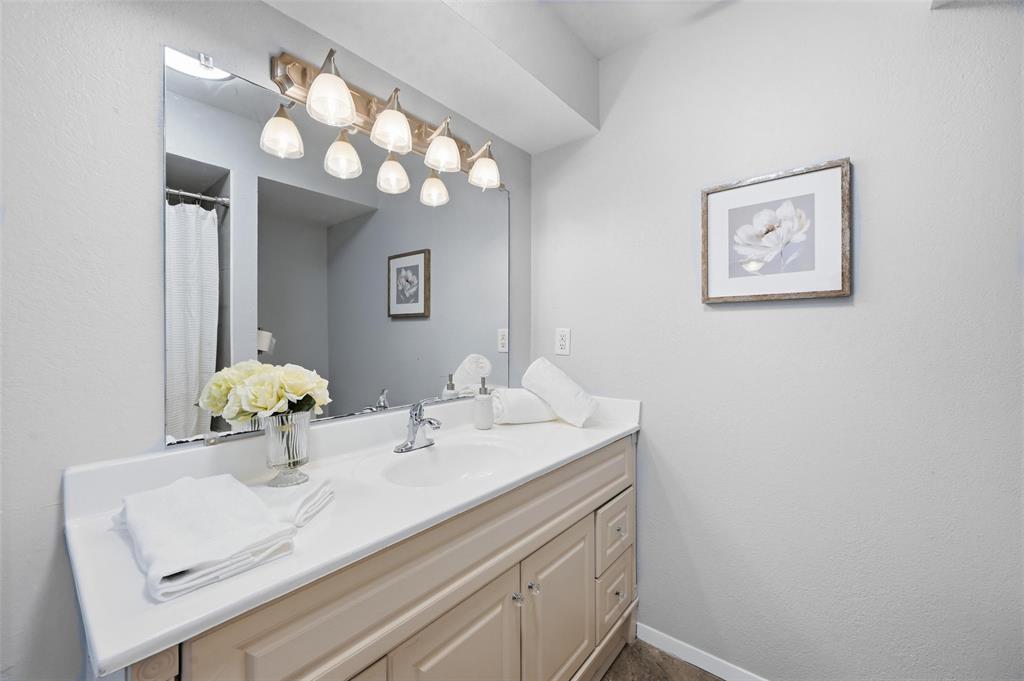 116 Main Place Euless, TX 76040 - Photo 15 of 31 a bathroom with a sink and a mirror