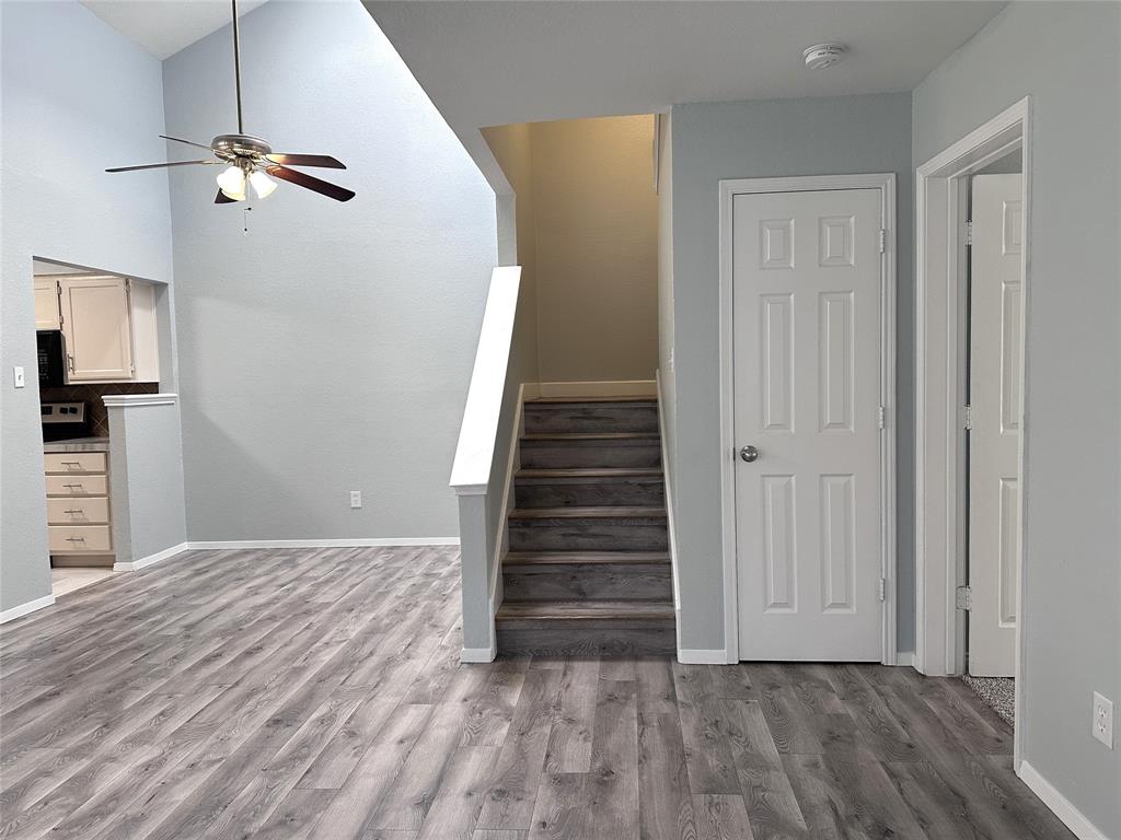 116 Main Place Euless, TX 76040 - Photo 20 of 31 a view of a livingroom with wooden floor and staircase